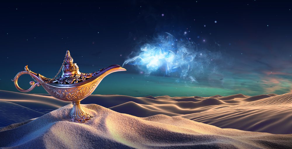A genie lamp in the desert with stars and galaxies