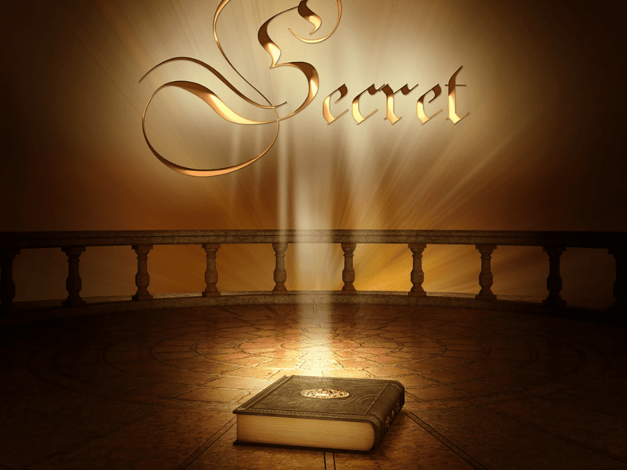 A book is lit up in front of the word " secret ".